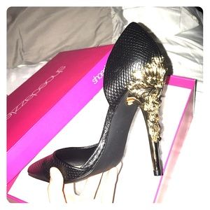 black high heels with gold design on back